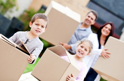 Packed moving boxes and furniture ready for local house removal service