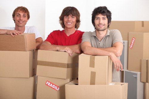Packed boxes and furniture loaded into a removal truck
