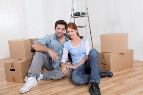 Professional furniture pick-up team handling bulky items in Hounslow